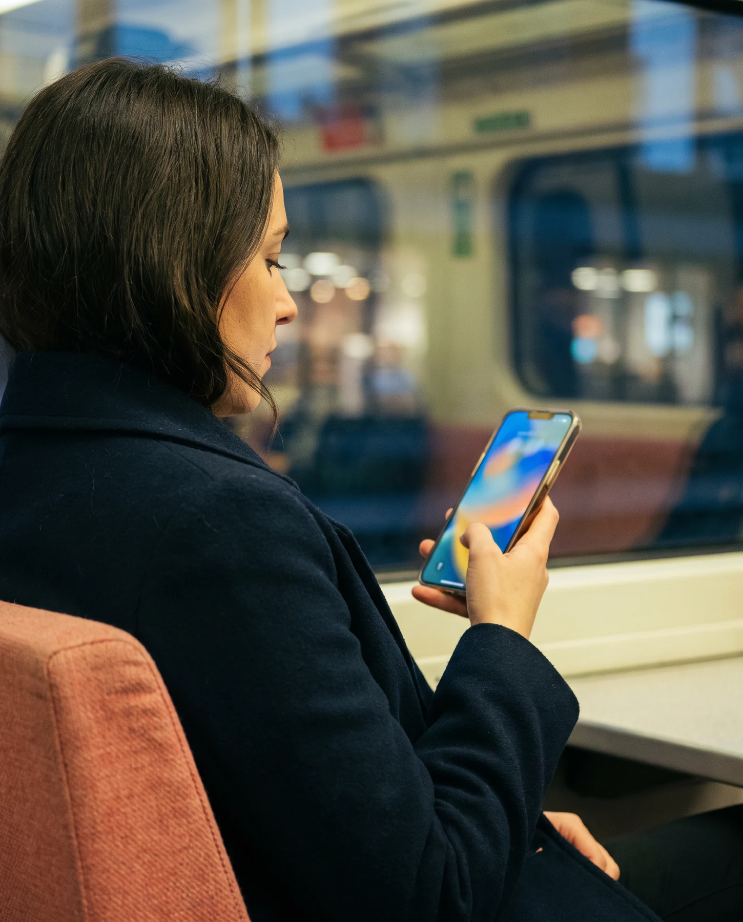 Person using a phone while travelling